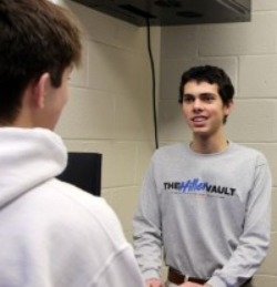One teller student talking with a student member 